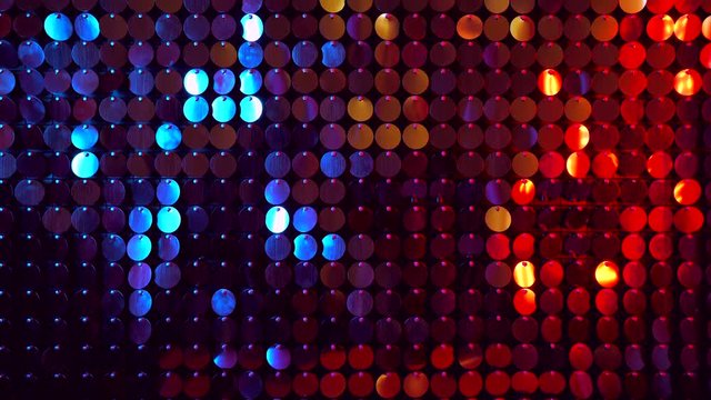 Red and blue sequins sparkling reflective background. Abstract kinetic glitter wall moving. Night club decoration. Can be used as transitions, added to modern projects,art backgrounds.