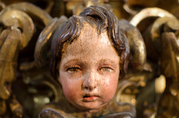 SEVILLE, SPAIN; March 28, 2018: closeup of a cherub angel in the Church of Saint Louis of France,...
