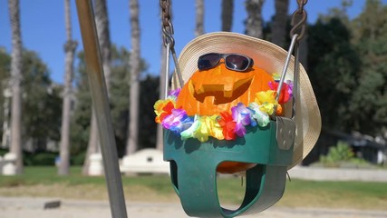 Happy Halloween pumpkin on the swing in 4K slow motion 60fps