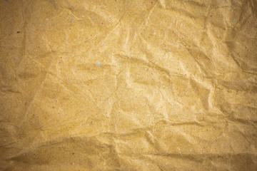 Vignette brown crumpled paper.