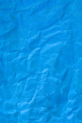 Texture crumpled blue paper background.