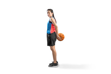 Asian woman basketball player holding the ball on his back