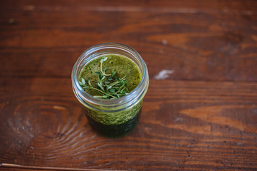 Spinach smoothie on the wood brown table