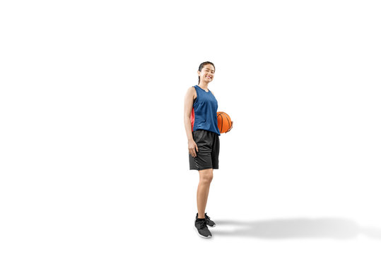 Asian woman basketball player holding the ball