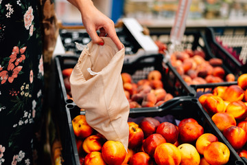 Baby knee with bloody scratch. Summer day on the grass. Toddler problem