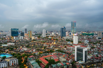 Fototapeta na wymiar Aerial skyline view of Hanoi city, Vietnam. Hanoi cityscape by sunset period at Ba Dinh district viewing from Lang Ha street