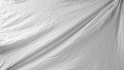 Obraz premium White crumpled textile, fabric background and texture