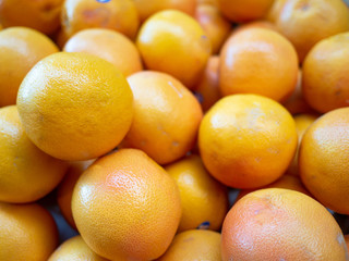 Heap of fresh red ruby grapefruit for sale in the market close up top view
