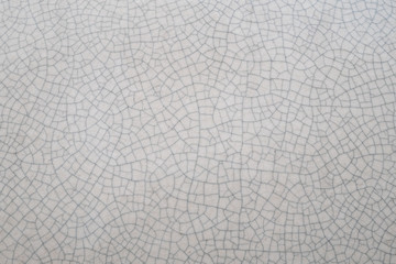 Cracked old white ceramic texture background