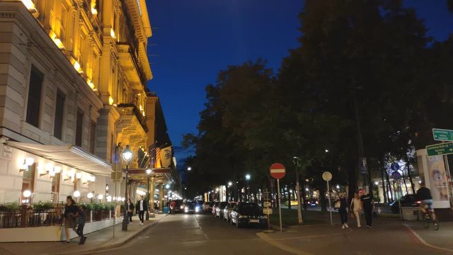 Vienna, Austria - September 15, 2018: Timelapse on the Schwarzenbergstra&szlig;e street with view on Hotel and Cafe Imperial with walking people