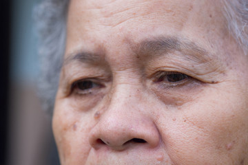 Cose-up of face senior woman worried