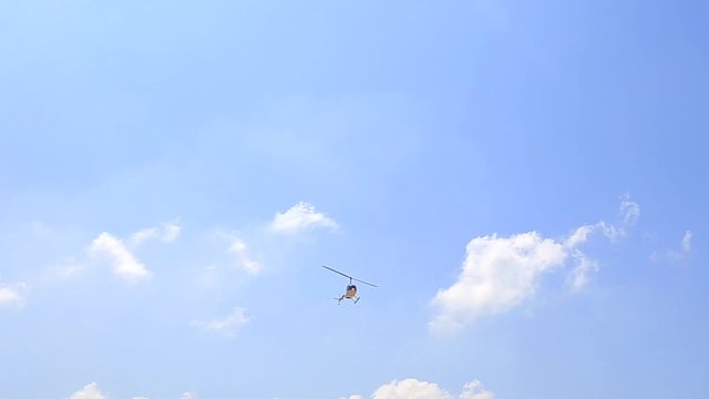 Helicopter flies over the beach
