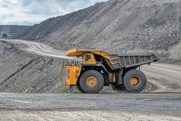 Rock transportation by dump trucks.