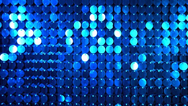 Blue sequins sparkling reflective background. Abstract kinetic glitter wall moving. Night club decoration. Can be used as transitions, added to modern projects,art backgrounds.