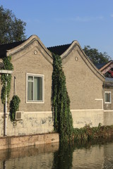 old house with garden near a lack in beijing city