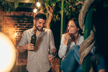 romantic evening for young couple at home garden, night moody scene