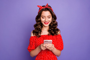 Beautiful lady holding telephone hands wear off-shoulders dress isolated purple background