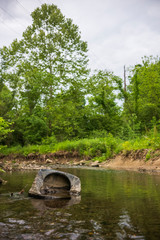 Fototapeta na wymiar Trash left behind in a creek in South Park, Pennsylvania.