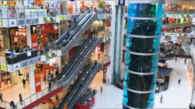 Blurred interior of Aviapark shopping mall with the highest aquarium in shopping centers in Moscow. Timelapse