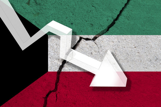 Kuwait Flag on the cracked wall with arrow falling down. Concept of decrease in the country.