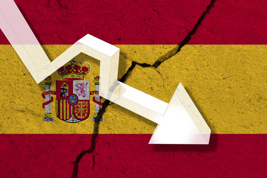 Spain Flag on the cracked wall with arrow falling down. Concept of decrease in the country.