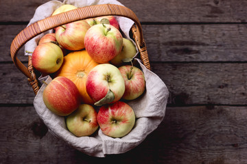 Organic Apples and Pumpkin in Basket on Old Wooden Background Harvest Autumn Fresh Fruits and Vegetables