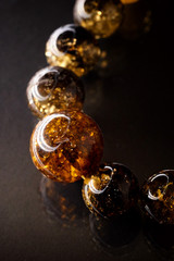 Unique pieces of transparent yellow amber on a white background.