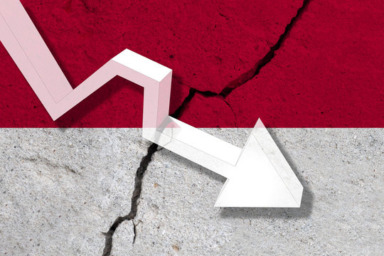 Indonesia Flag on the cracked wall with arrow falling down. Concept of decrease in the country.