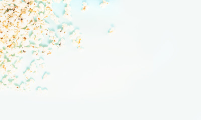 Scattered popcorn over yellow background