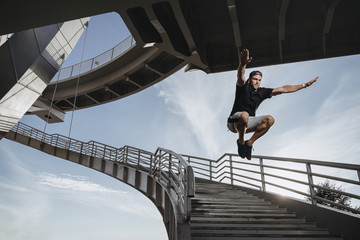 Man doing parkour in city