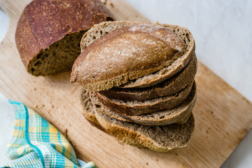 Ciabatta Sourdough Bread with Olive Oil on Wooden Board.