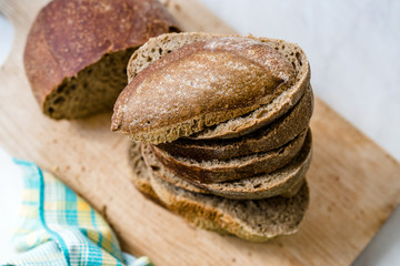 Ciabatta Sourdough Bread with Olive Oil on Wooden Board.