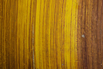 A faux or fake wood grain texture on cement bench
