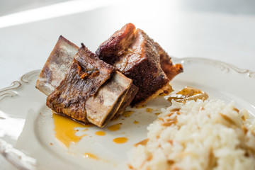 Veal Ribs Chop Meat with Rice Pilav / Pilaf served in Plate.