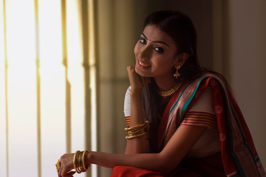 portrait of a south indian woman looking at the camera	