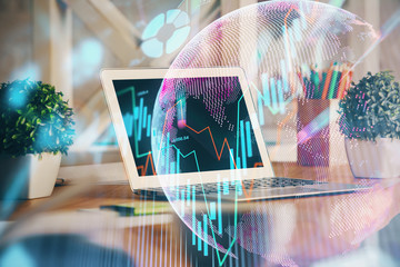 Multi exposure of graph and financial info and work space with computer background. Concept of...
