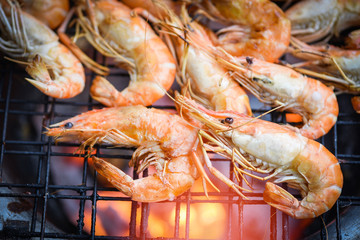 shrimp grilled bbq seafood on stove / prawns shrimps cooked burnt on grill barbecue