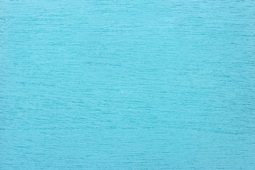 Texture of light blue clean woody background, closeup.