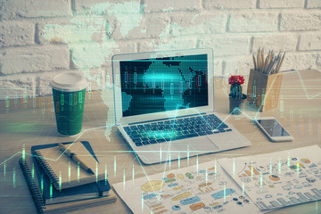 Multi exposure of chart and financial info and work space with computer background. Concept of...