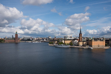 Fototapeta na wymiar Sunny view over Riddarholmen at the lake Mälaren in Stockholm a summer day 