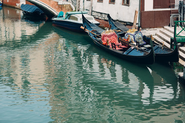 Fototapeta na wymiar Venetian gondola and canal in Venice, Italy