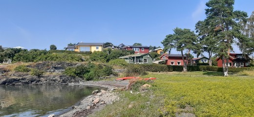 Fototapeta na wymiar Island Lindoya in Oslo Fjord, Norway. Island with summer cottages and marina in summer. 
