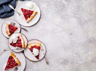 Bakery products. Summer pie with berries. Galeta with cherry sprinkled with powdered sugar. Copy...