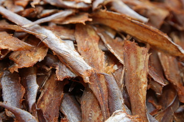dried salt fish, stockfish, salted peeled fish, fish chips, snacks. snacks food beer. Beer snack industry. background, texture