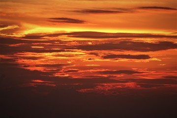Naklejka na ściany i meble Sunset and sunrise with beautiful red clouds