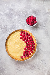 Obraz na płótnie Canvas Cooking the cake with custard and raspberries. Berry baking. Summer tart.
