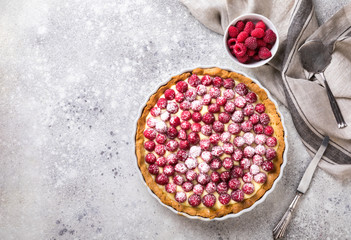 Cooking the cake with custard and raspberries. Berry baking. Summer tart.