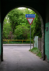Road sign on city background