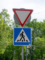 Road sign on city background