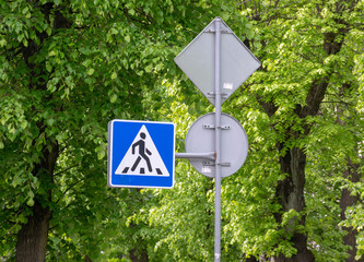 Road sign on city background